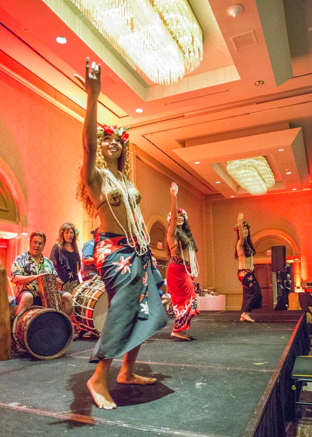Polynesian cultural dance performance in traditional colorful costume