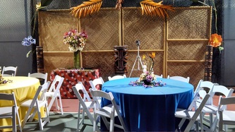 Beach sunset party setup with chairs and tables overlooking the ocean