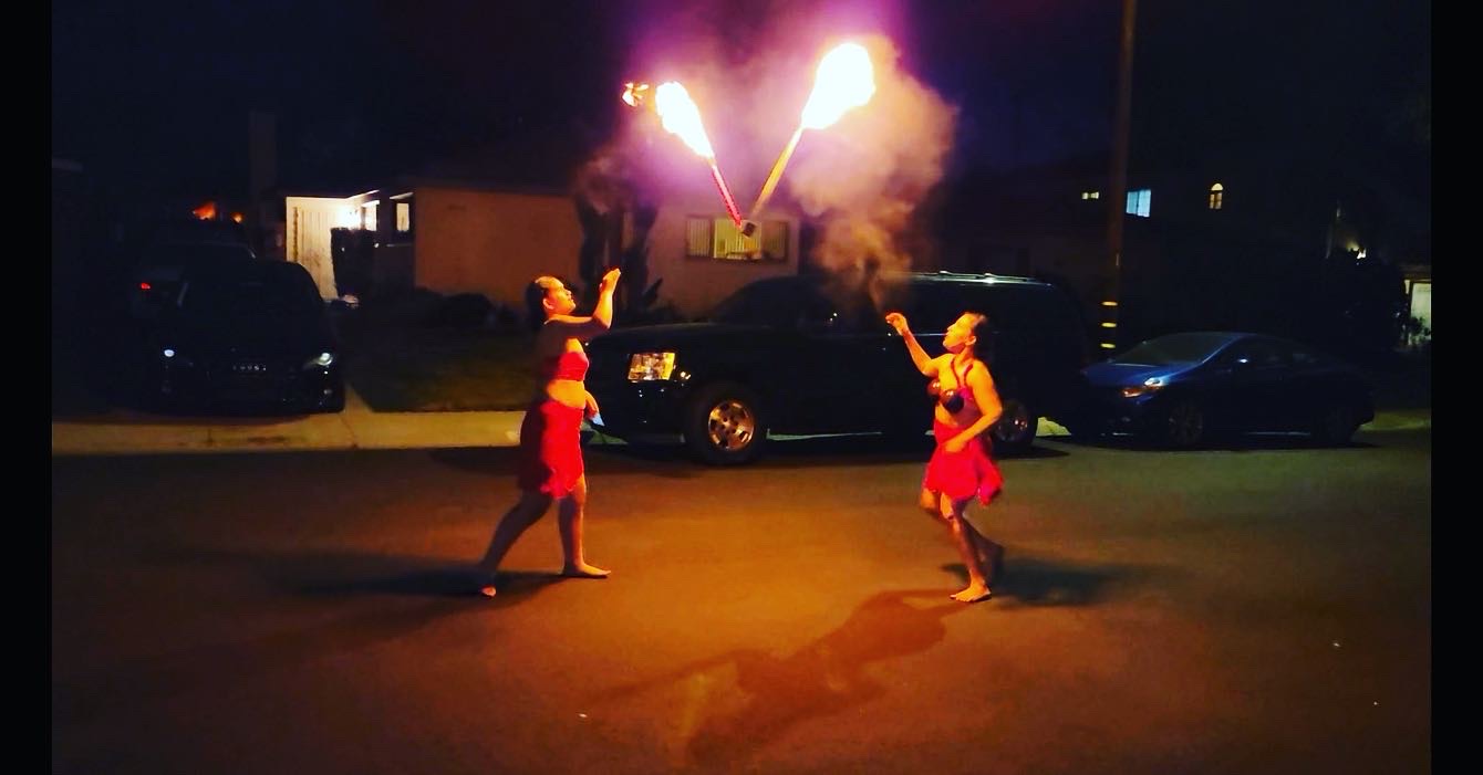 Polynesian fire dancers performing at a Southern California luau party