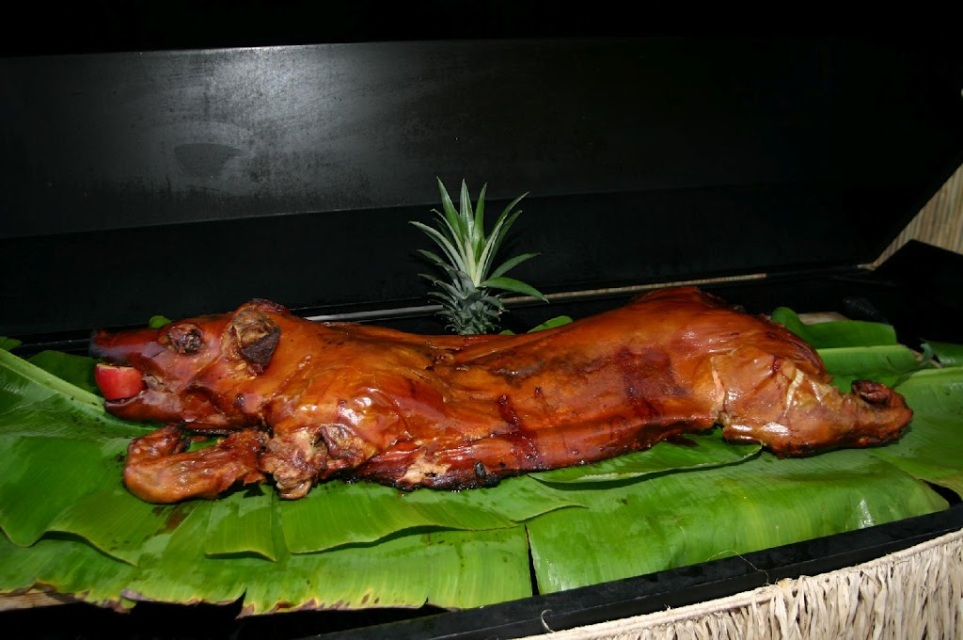 Whole roasted pig dinner served at a Hawaiian luau for 50 guests
